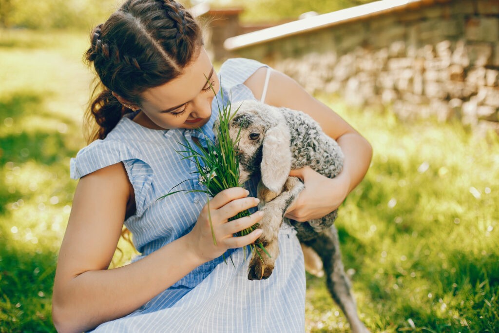 beautiful girl with goat