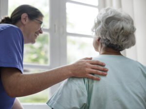 Nurse taking care of an old woman