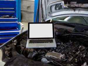 Laptop on car bonnet