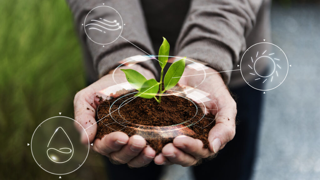 Smart agriculture IoT with hand planting tree background